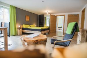 a room with a bed and a table and chairs at Residence Martell Mountains in Martello