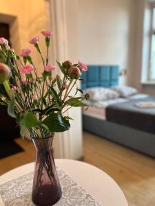 Łóżko lub łóżka w pokoju w obiekcie Apartamenty Wolności 18