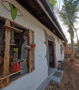 a side view of a house with a window at C U Hostel in Trincomalee