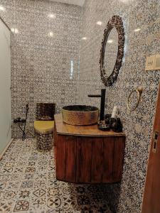 a bathroom with a sink and a mirror at Qiz Galasi Hotel Baku in Baku +135 photos
