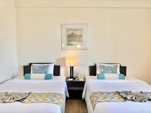 Phuket Merlin Hotel客房内的一张或多张床位