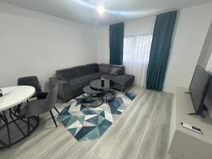 a living room with a couch and a table at Sweet Holiday in Mostar