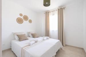 Postel nebo postele na pokoji v ubytování Villa Mimosa