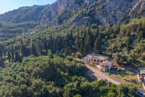 an aerial view of a house in the mountains at Two bedrooms apartment Vasillis in Paleokastritsa