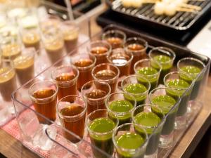 a tray of glasses filled with different types of drinks at APA Hotel Yodoyabashi Kitahama Ekimae in Osaka