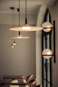 a row of chairs in a room with lights at Akti Hotel Kavala in Paleo Tsifliki