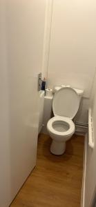 a bathroom with a white toilet in a room at Newmarket house in Newmarket