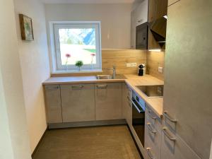 Una cocina o kitchenette en Mountain View Appartements mit Blick