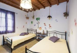 Uma cama ou camas num quarto em Apt with Amazing Balcony View of Mykonos