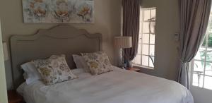 Ένα ή περισσότερα κρεβάτια σε δωμάτιο στο Green Willows Guest House