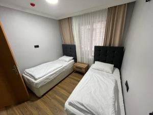 Postel nebo postele na pokoji v ubytování adora apart