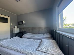 Postel nebo postele na pokoji v ubytování KEJA Pustkowo + 6 fotografií