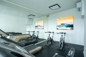 a gym with bikes parked in a room at Hotel Golf Prague in Prague