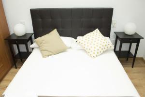 Postel nebo postele na pokoji v ubytování Apartamenticos Boggiero IV