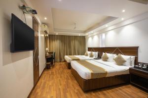 Hotel Avon Ruby Dadar 객실 침대