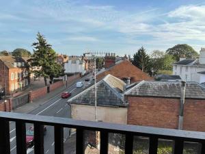 a view of a city street from a balcony at One bedroom loft apartment central Worcester in Henwick +5 photos