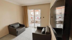 Posezení v ubytování Ozlem 2 Apart Hotel