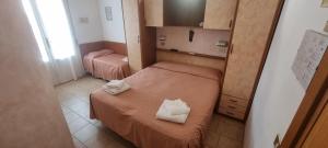 Postel nebo postele na pokoji v ubytování Hotel Rosa