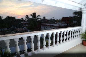 a balcony with a view of the city at Villa Baywalk Goa - 200 meters from Morjim Beach in Morjim