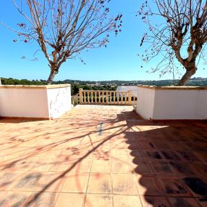 a view from the roof of a house with two trees at Villas Monte Jávea - BTB in Jávea