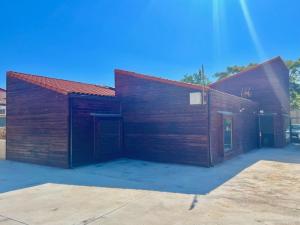 a small wooden building with a red roof at Blesamemucho - Casa Rural Situada en BLESA in Blesa