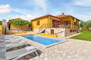 a villa with a swimming pool and a house at Villa Umag Istria seaview private pool and garage by Rentistra in Umag