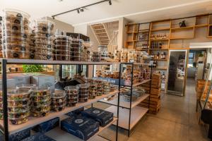 a store filled with shelves filled with pottery at Hofparken Wiltershaar in Winterswijk +31 photos