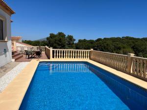 a swimming pool on top of a balcony at Villas Monte Jávea - BTB in Jávea