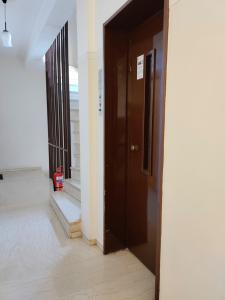 an open door in a building with a fire extinguisher at Old Town Apartment next to Seafront Promenade in Nafplio +21 photos