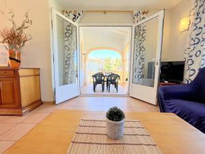 a living room with a couch and a table at Villas Monte Jávea - BTB in Jávea