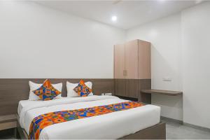 Postel nebo postele na pokoji v ubytování FabHotel Prime Athiti Delight Stay + 37 fotografií