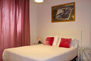 Posteľ alebo postele v izbe v ubytovaní Hostal Extramuros