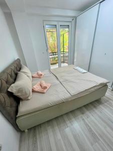 Postel nebo postele na pokoji v ubytování Elkos Apartment
