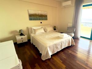 Ένα ή περισσότερα κρεβάτια σε δωμάτιο στο Seafront Luxury Apartment