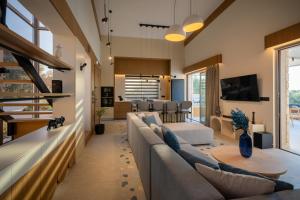 a living room with a couch and a table at Bliss Villas in Rethymno Town