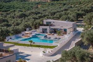 an aerial view of a house with a swimming pool at Bliss Villas in Rethymno Town