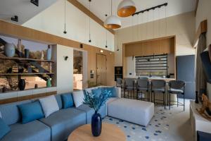 a living room with a couch and a table at Bliss Villas in Rethymno Town