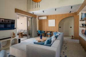 a living room with a couch and a table at Bliss Villas in Rethymno Town