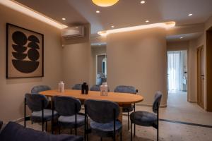 a conference room with a wooden table and chairs at Bliss Villas in Rethymno Town