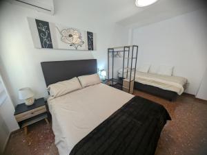 Postel nebo postele na pokoji v ubytování Piso Céntrico Armilla