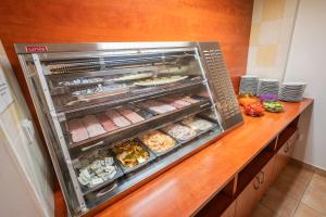 a kitchen with an oven with food in it at City Central De Luxe in Prague