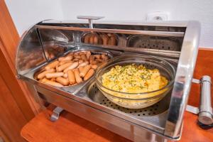 a toaster oven filled with lots of different types of food at City Central De Luxe in Prague