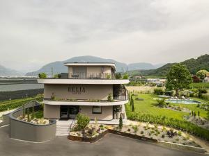 an aerial view of a building with a garden at Belia Lofts - ADULTS ONLY - Apartments in Appiano sulla Strada del Vino