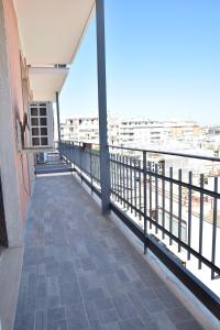 a balcony of a building with a view of the water at VERETO apartaments Lecce in Lecce