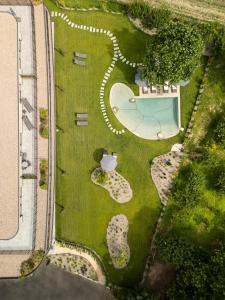 an overhead view of a garden with a swimming pool at Belia Lofts - ADULTS ONLY - Apartments in Appiano sulla Strada del Vino