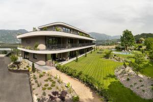 an aerial view of a house with a garden at Belia Lofts - ADULTS ONLY - Apartments in Appiano sulla Strada del Vino
