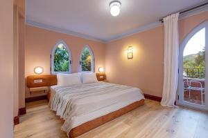 Postel nebo postele na pokoji v ubytování Yonca Anjelika Otel
