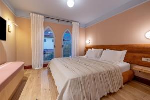 Postel nebo postele na pokoji v ubytování Yonca Anjelika Otel
