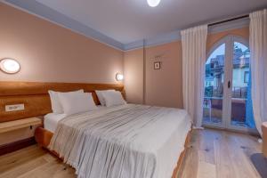 Postel nebo postele na pokoji v ubytování Yonca Anjelika Otel