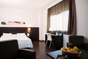 Postel nebo postele na pokoji v ubytování Hotel Sercotel Plana Parc